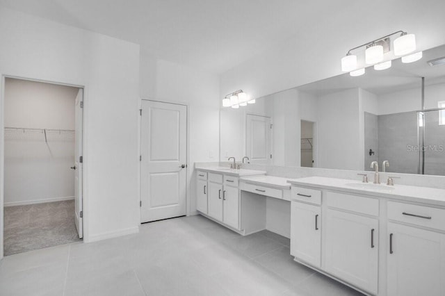 bathroom with tile patterned floors and vanity