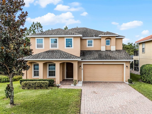 view of front of house featuring a front yard and a garage