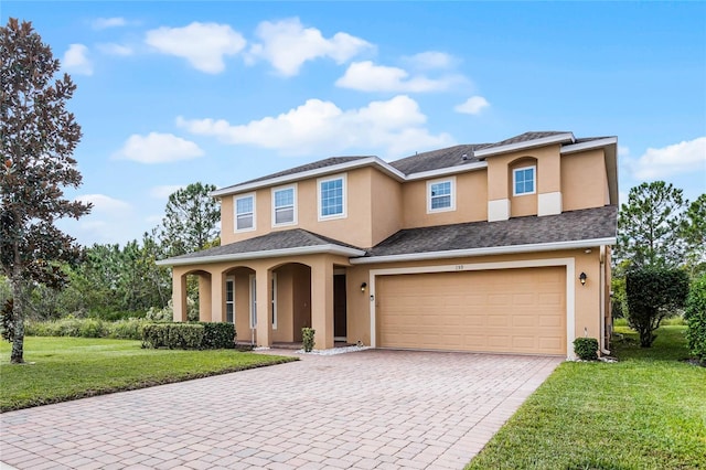 view of front of house featuring a garage and a front yard