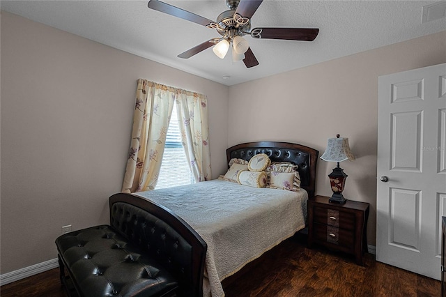 bedroom with ceiling fan and dark hardwood / wood-style flooring