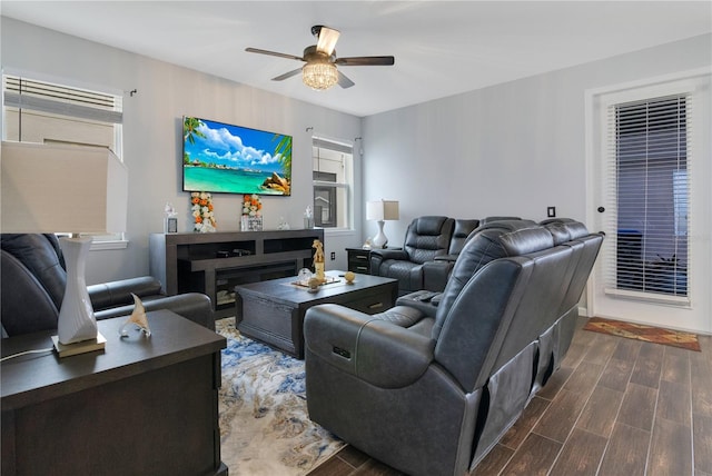 living room featuring dark hardwood / wood-style floors and ceiling fan