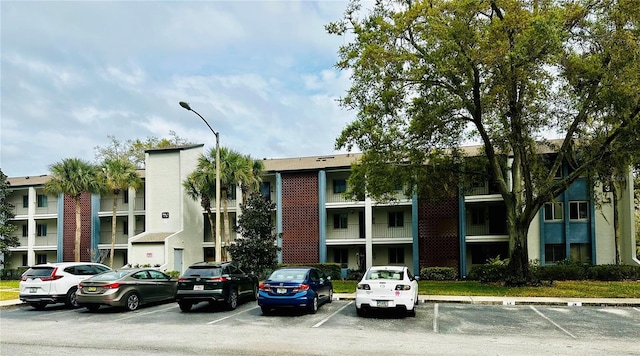 3 Escondido Cir Unit 18, Altamonte Springs, FL 32701 - view of property featuring uncovered parking