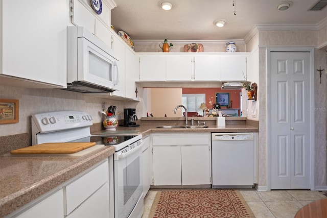 kitchen with ornamental molding, white appliances, sink, light tile patterned floors, and white cabinetry