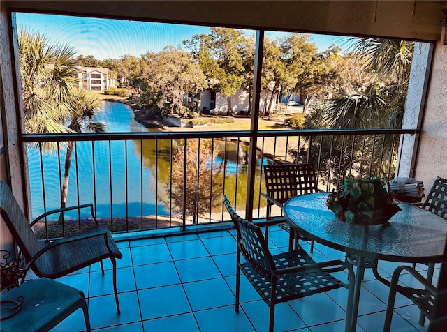 balcony featuring a water view