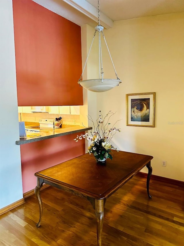 3 Escondido Cir Unit 18, Altamonte Springs, FL 32701 - dining room featuring wood finished floors and baseboards