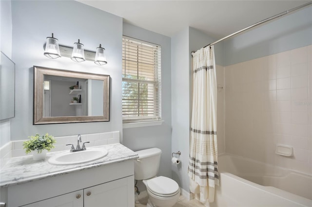 full bathroom featuring vanity, shower / bath combo, and toilet