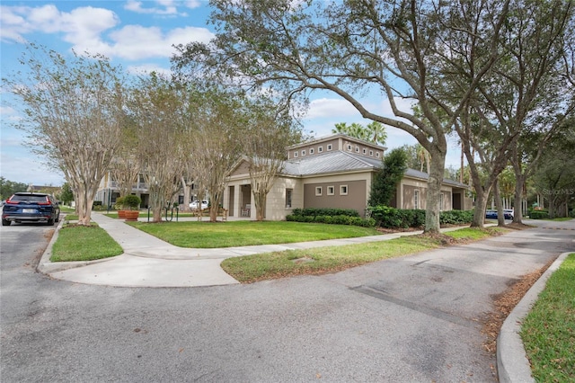 greek revival house with a front lawn