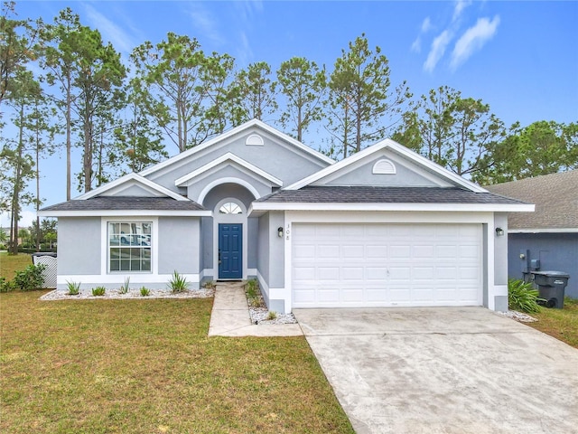 single story home with a front yard and a garage