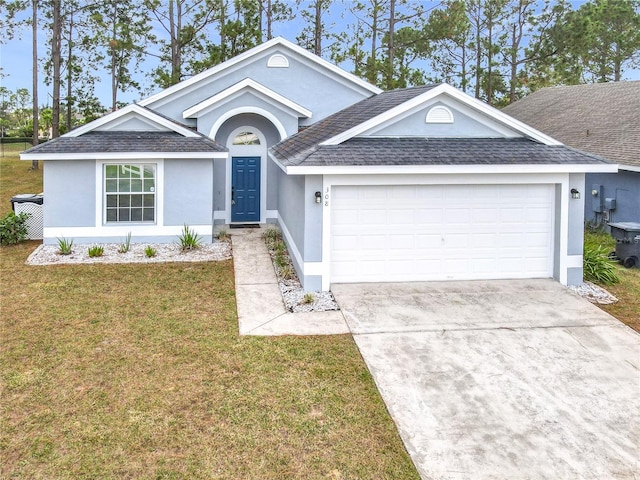 single story home with a garage and a front lawn