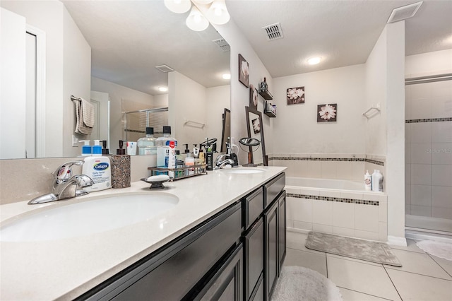 bathroom featuring separate shower and tub, tile patterned flooring, and vanity