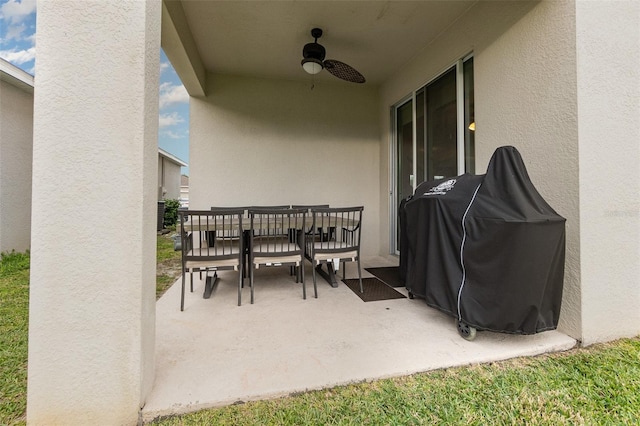 view of patio with area for grilling and ceiling fan