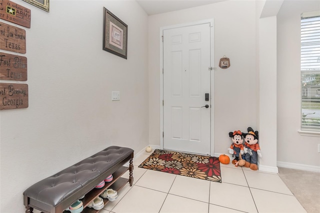 foyer featuring light tile patterned floors