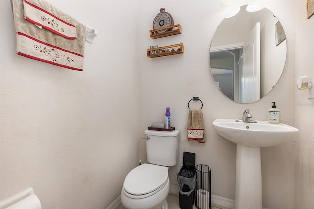 bathroom featuring sink and toilet