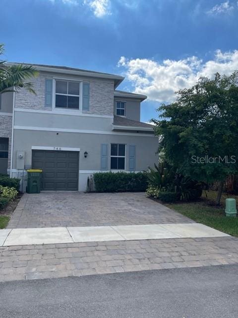 front of property with a garage