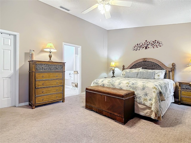 carpeted bedroom with ceiling fan and connected bathroom