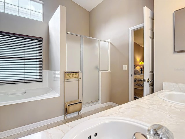 bathroom featuring independent shower and bath and vanity