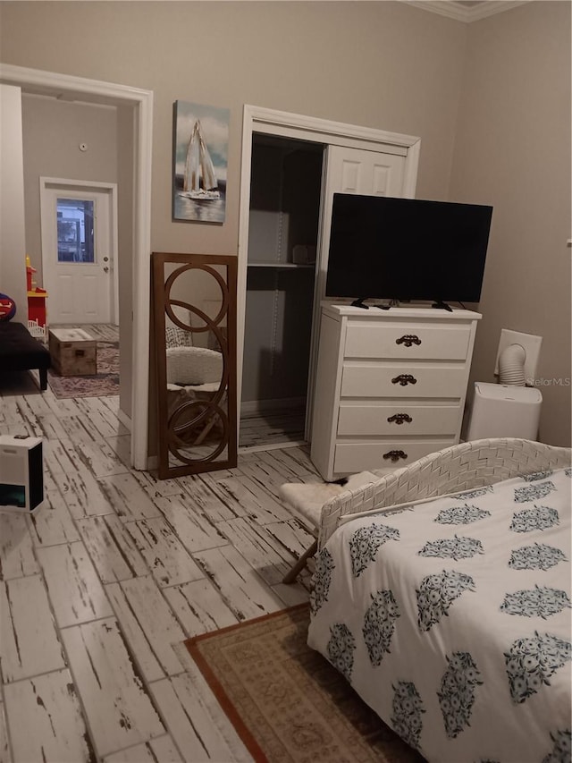 bedroom featuring light wood-type flooring and a closet