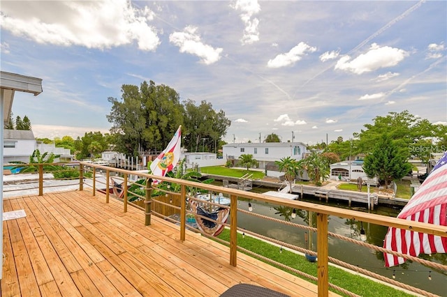 wooden deck featuring a water view