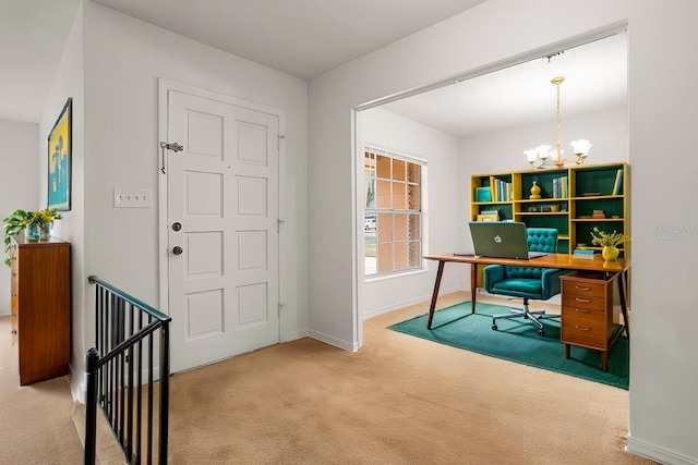 home office with carpet floors and a chandelier