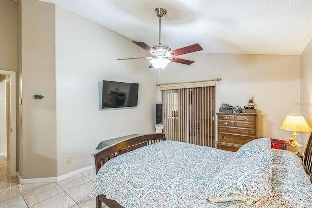 bedroom with light tile patterned floors, vaulted ceiling, and ceiling fan