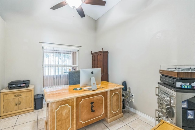 tiled office with ceiling fan and a towering ceiling