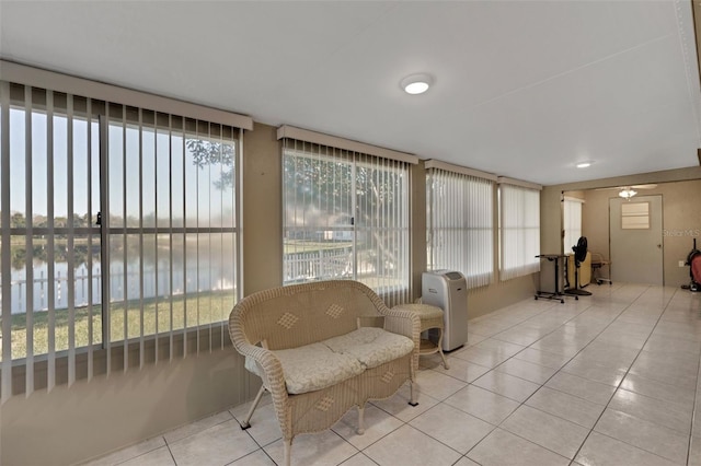 sunroom / solarium with a water view