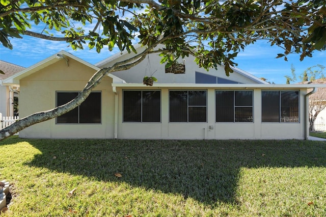 view of home's exterior with a yard