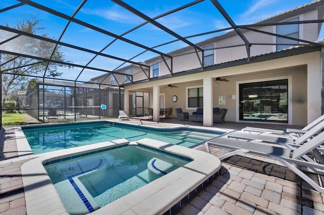 view of pool with ceiling fan, a lanai, an outdoor living space, a patio area, and an in ground hot tub