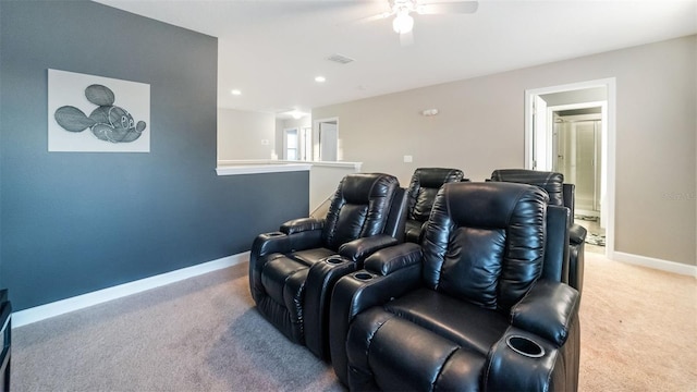 home theater featuring ceiling fan and carpet