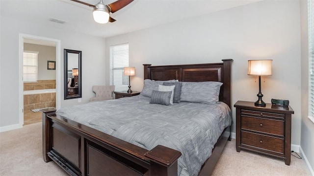 carpeted bedroom featuring connected bathroom and ceiling fan