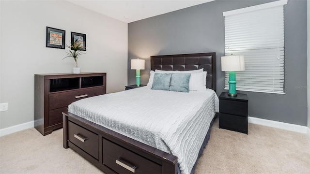 bedroom with light colored carpet