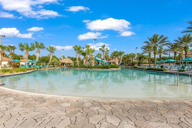 view of pool with a water slide