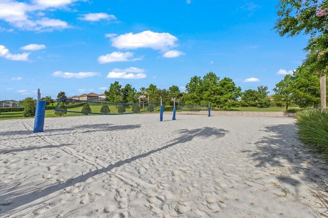 view of home's community featuring volleyball court