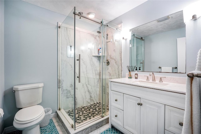 bathroom with tile patterned flooring, vanity, toilet, and an enclosed shower