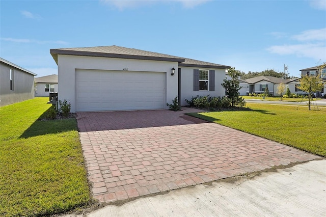 ranch-style home featuring a garage and a front yard