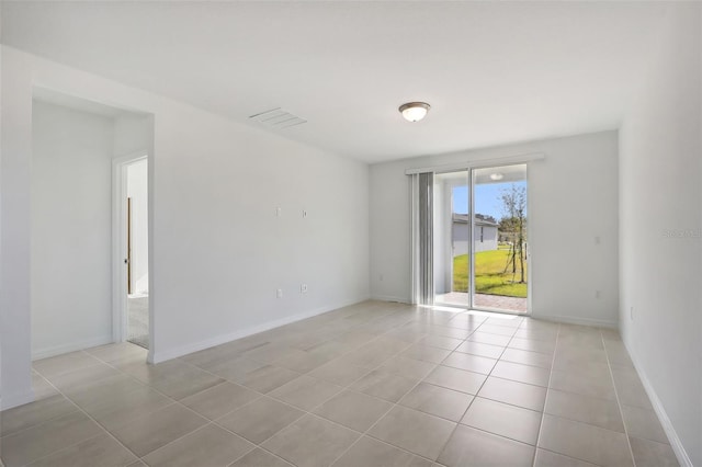 empty room with light tile patterned floors