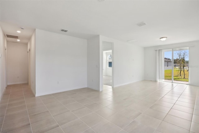 empty room with light tile patterned floors