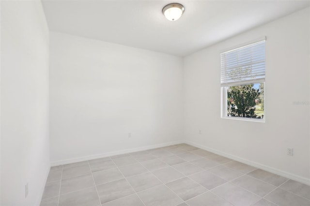 unfurnished room with light tile patterned floors