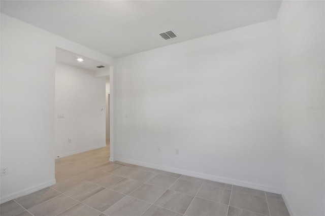 empty room featuring light tile patterned floors