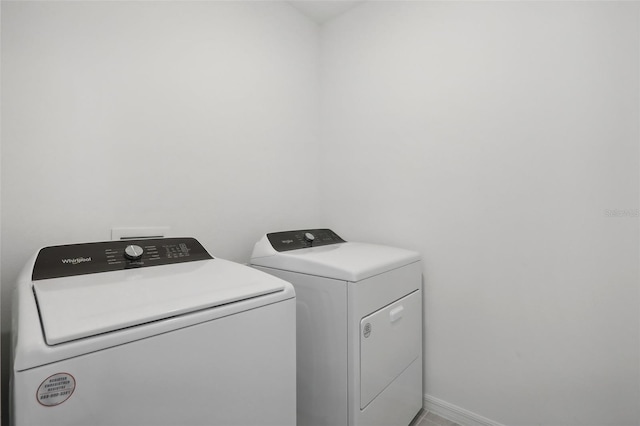 washroom with independent washer and dryer