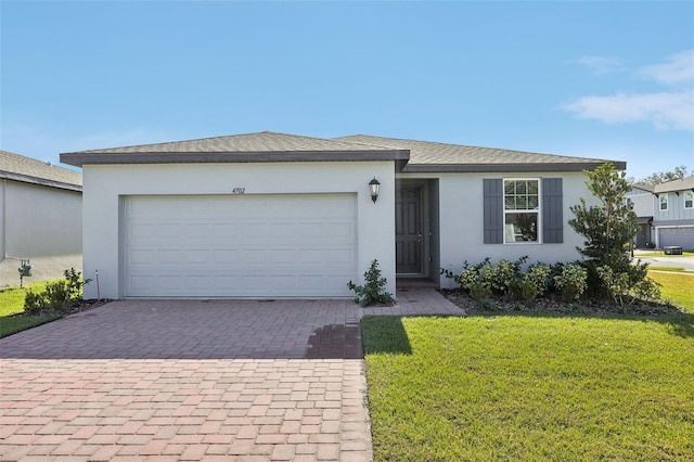 ranch-style home with a front yard and a garage