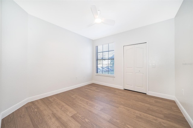 empty room featuring light hardwood / wood-style floors and ceiling fan