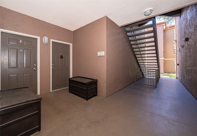 foyer entrance with concrete flooring