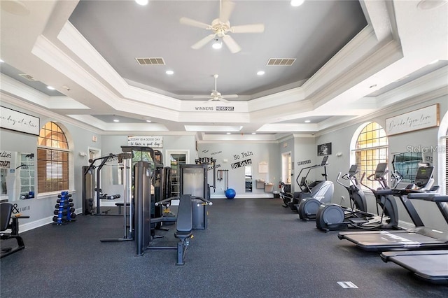 gym featuring ceiling fan and ornamental molding