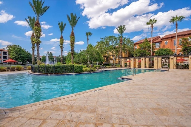 view of swimming pool with a patio