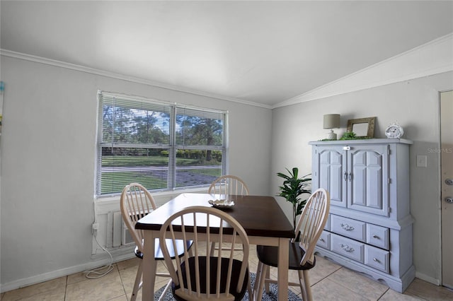 tiled dining space featuring a wealth of natural light, lofted ceiling, and ornamental molding