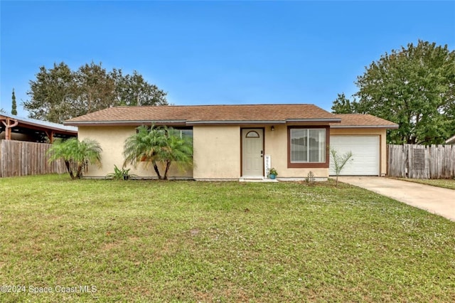 single story home with a garage, fence, concrete driveway, stucco siding, and a front yard