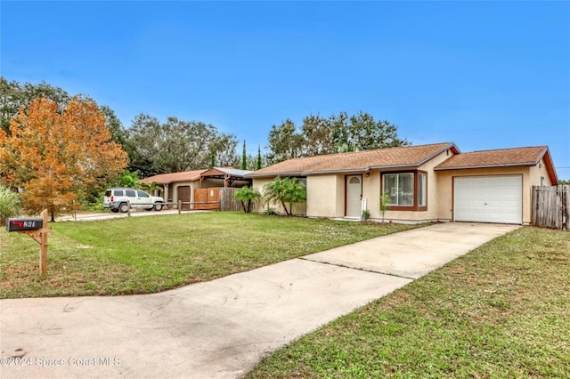 ranch-style house with a front lawn and a garage