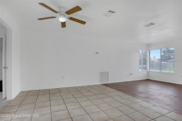 unfurnished room featuring light hardwood / wood-style floors and ceiling fan