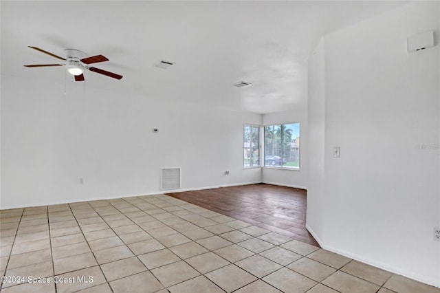 unfurnished room featuring ceiling fan and light hardwood / wood-style flooring